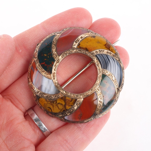 1100 - An Antique Scottish gold and hardstone circular brooch, mid/late 19th century, circular openwork lob... 