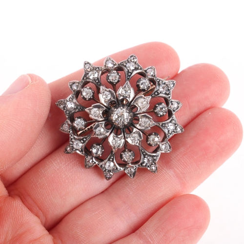 1111 - An Antique Victorian diamond flowerhead brooch/pendant, circa 1860, cut-down collet set with old-cut... 