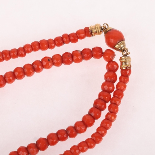 1113 - An Antique single-strand faceted coral bead necklace, set with graduated coral beads ranging from 6.... 