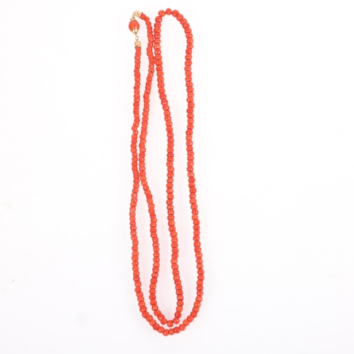 1113 - An Antique single-strand faceted coral bead necklace, set with graduated coral beads ranging from 6.... 