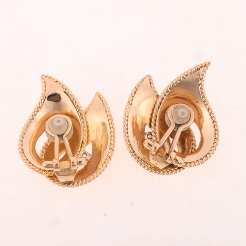 1118 - A pair of French 18ct gold diamond leaf clip-on earrings, maker LW, of stylised openwork form set wi... 