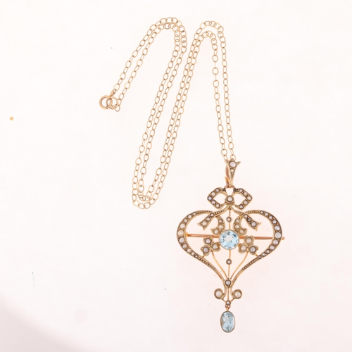 1138 - An Antique Edwardian 9ct gold aquamarine and split pearl openwork pendant necklace/brooch, circa 191... 