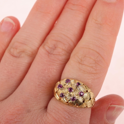 1140 - A Vintage 18ct gold ruby bombe ring, circa 1970s, textured and pierced lattice decoration set with r... 