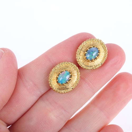 1143 - A pair of 18ct gold opal triplet stud earrings, oval form with textured decoration, claw set with ov... 