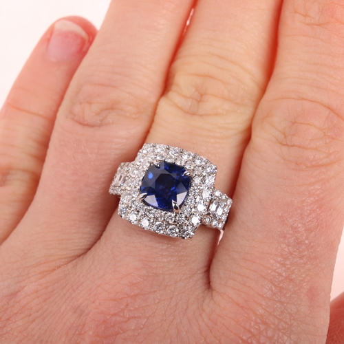 1150 - An 18ct white gold Sri Lankan sapphire and diamond cluster ring, claw set with 2.58ct cushion-cut sa... 