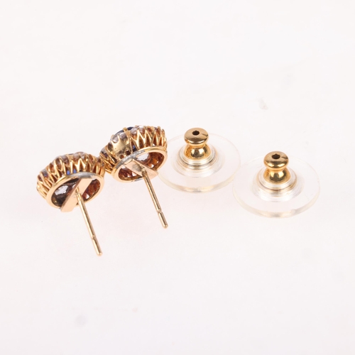 1151 - A pair of 18ct gold sapphire and white sapphire cluster stud earrings, each set with cushion-cut sap... 