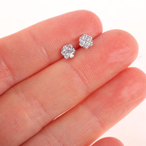 1155 - A pair of 18ct white gold diamond cluster stud earrings, set with modern round brilliant-cut diamond... 