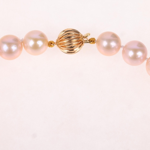 1156 - A single-strand natural pink freshwater cultured pearl necklace, set with individually knotted 9.5-1... 