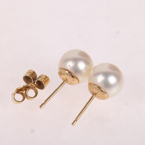 1157 - A pair of 9ct gold whole pearl stud earrings, each set with 8.9mm pearl, 2.7g