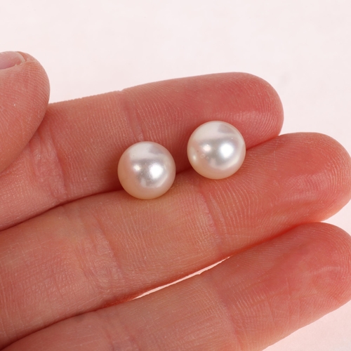 1157 - A pair of 9ct gold whole pearl stud earrings, each set with 8.9mm pearl, 2.7g