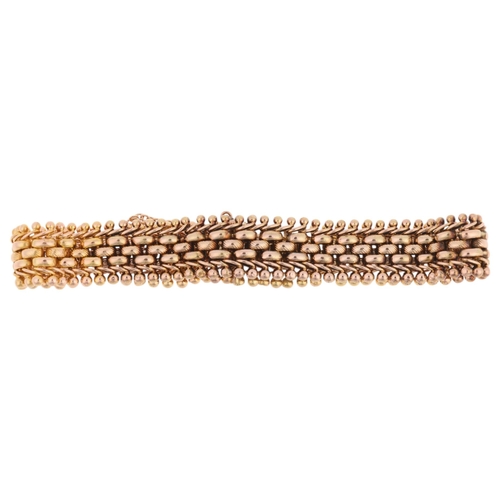 1165 - A Continental 14ct gold gatelink bracelet, textured and polished decoration, unmarked mount tests as... 