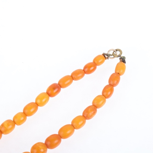 1173 - A Vintage single-strand graduated butterscotch amber bead necklace, beads ranging from 13.2-7.8mm, 3... 