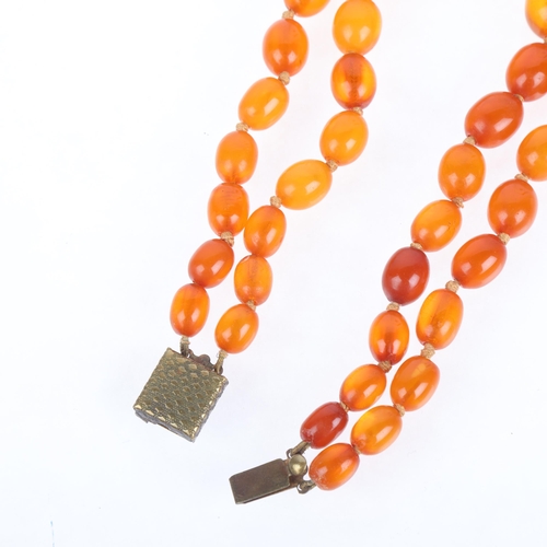 1174 - A Vintage double-strand graduated amber bead necklace, beads ranging from 18.6-9.7mm, 32cm, 45.8g