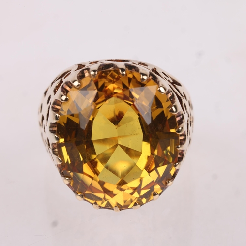 1181 - A Vintage 9ct gold yellow synthetic sapphire dress ring, indistinct maker, London 1970, set with ova... 