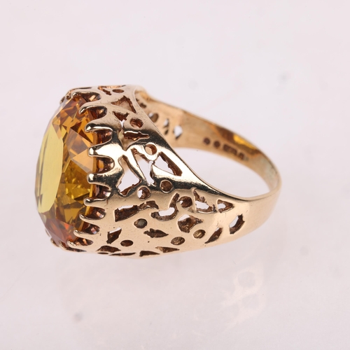 1181 - A Vintage 9ct gold yellow synthetic sapphire dress ring, indistinct maker, London 1970, set with ova... 