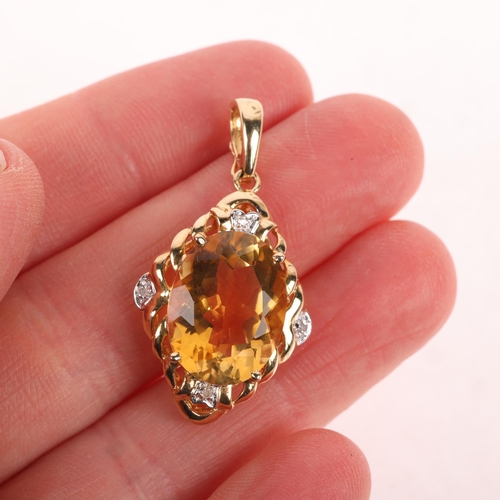 1182 - A 14ct gold citrine and diamond drop pendant, the lozenge frame claw set with oval mixed-cut citrine... 