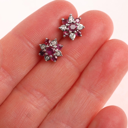 1187 - A pair of 9ct gold ruby and diamond flowerhead cluster stud earrings, unmarked mount tests as 9ct, 9... 