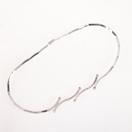 1196 - A 9ct white gold diamond collar necklace, overlapping design rub-over set with modern round brillian... 