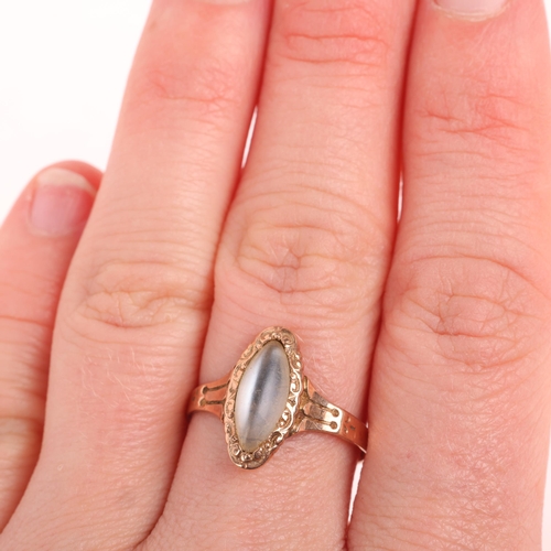 1199 - An Antique 9ct rose gold moonstone dress ring, set with marquise cabochon moonstone within chased sc... 