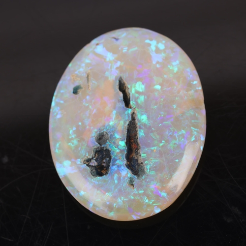 1222 - An unmounted 35ct oval double cabochon synthetic opal, 34.0 x 26.7 x 7.3mm, 7g