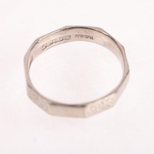 1229 - An 18ct white gold wedding band ring, maker HG&S, Birmingham 1964, faceted form with engraved scroll... 