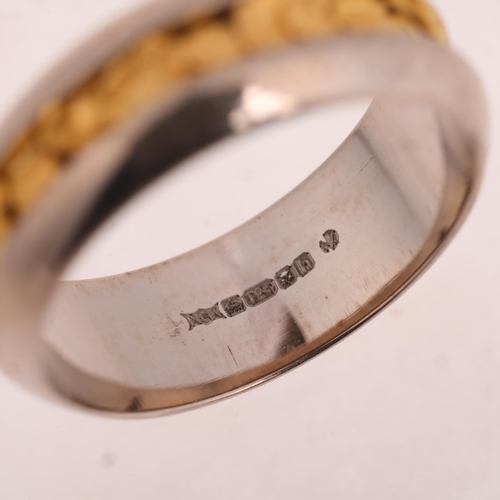 1233 - An 18ct gold 'Nugget' wedding band ring, maker NCK, London 2007, band width 6.1mm, size J, 5.2g