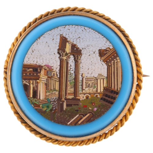 1243 - An Antique Italian Grand Tour 14ct gold micro-mosaic 'Roman Ruins' panel brooch, circa 1850, the rou... 