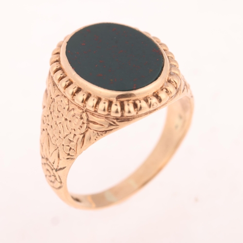 1244 - A large 9ct rose gold bloodstone signet ring, indistinct maker, London 1974, set with polished oval ... 