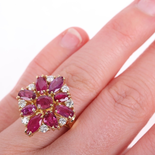 1245 - A 14ct gold ruby and diamond cluster cocktail ring, set with vari-cut rubies and modern round brilli... 