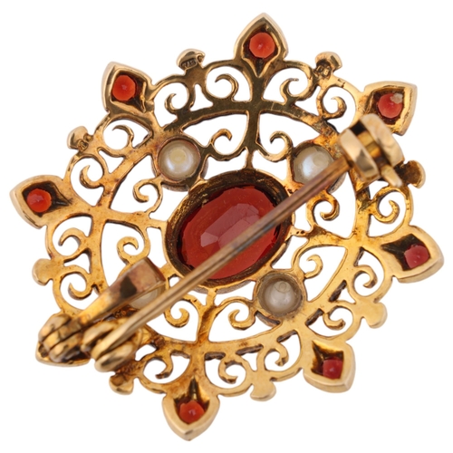 1260 - A 9ct gold garnet and pearl openwork brooch/pendant, maker BJ, London 1986, 29.8mm, 4.9g