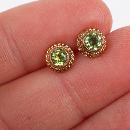 1277 - A pair of 9ct gold peridot stud earrings, with rope twist surround, 6.7mm, 1.2g