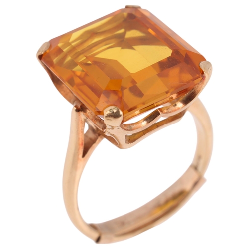 1294 - A 9ct gold single stone yellow synthetic sapphire dress ring, London 1969, claw set with octagonal s... 