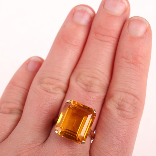 1294 - A 9ct gold single stone yellow synthetic sapphire dress ring, London 1969, claw set with octagonal s... 