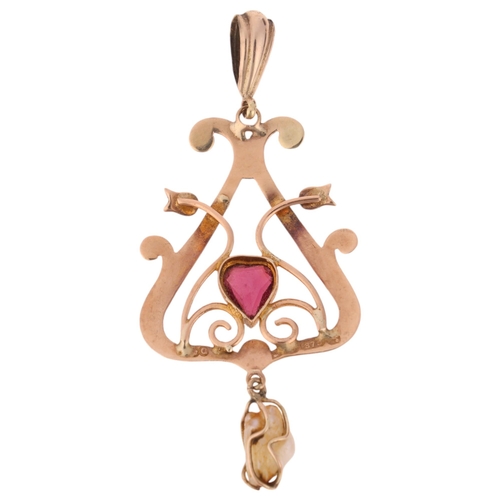 1303 - An Antique Edwardian 9ct rose gold garnet and Baroque pearl openwork pendant, set with heart-cut gar... 