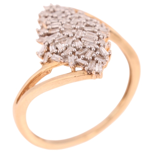 1310 - A 9ct gold diamond cluster crossover ring, set with tapered baguette-cut diamonds, total diamond con... 