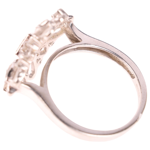 1311 - A large modern 9ct white gold diamond flowerhead cocktail ring, set with modern round brilliant-cut ... 