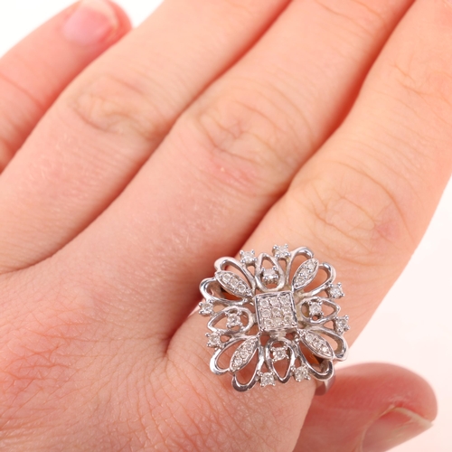 1311 - A large modern 9ct white gold diamond flowerhead cocktail ring, set with modern round brilliant-cut ... 