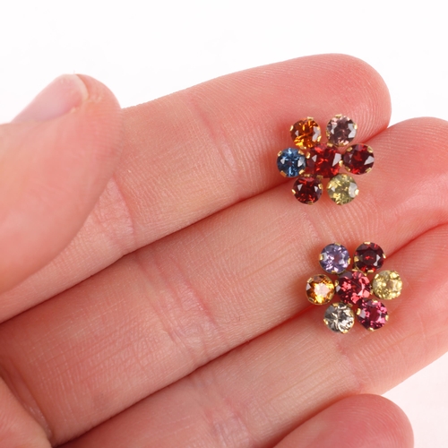 1317 - A pair of 14ct gold gem set flowerhead stud earrings, with screw-back fittings, unmarked mount tests... 