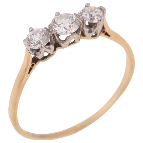 1320 - An 18ct gold three stone diamond ring, platinum-topped set with modern round brilliant-cut diamonds,... 