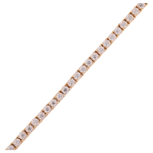 1325 - A 14ct gold cubic zirconia tennis line bracelet, 17cm, 12.8g