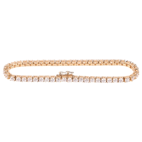 1325 - A 14ct gold cubic zirconia tennis line bracelet, 17cm, 12.8g