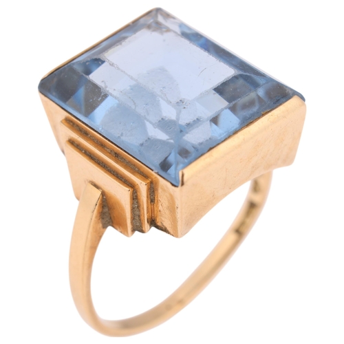 1332 - A Swedish 18ct gold blue topaz dress ring, set with rectangular step-cut topaz, setting height 16.8m... 