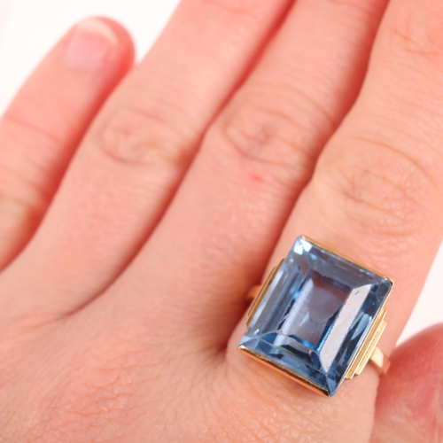 1332 - A Swedish 18ct gold blue topaz dress ring, set with rectangular step-cut topaz, setting height 16.8m... 