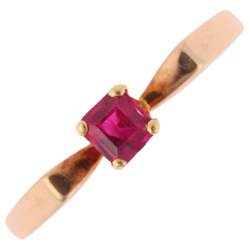 1347 - A 9ct gold single stone ruby dress ring, London 1980, claw set with rectangular step-cut ruby, setti... 