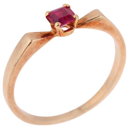 1347 - A 9ct gold single stone ruby dress ring, London 1980, claw set with rectangular step-cut ruby, setti... 