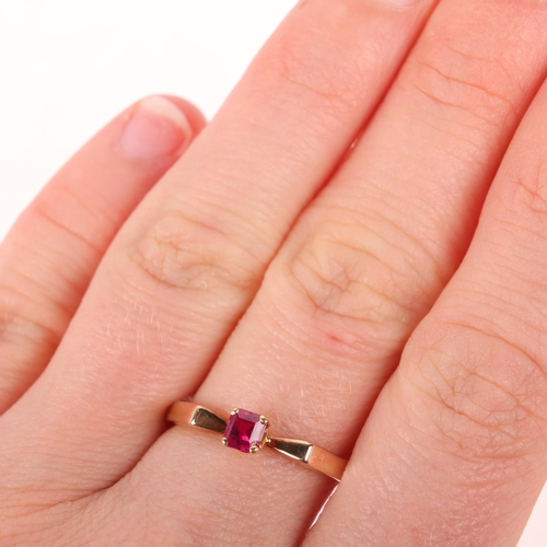 1347 - A 9ct gold single stone ruby dress ring, London 1980, claw set with rectangular step-cut ruby, setti... 