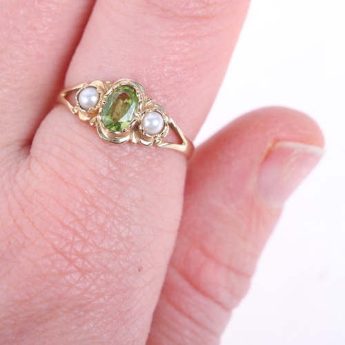 1356 - A 9ct gold three stone peridot and pearl ring, setting height 8.4mm, size O, 1.7g