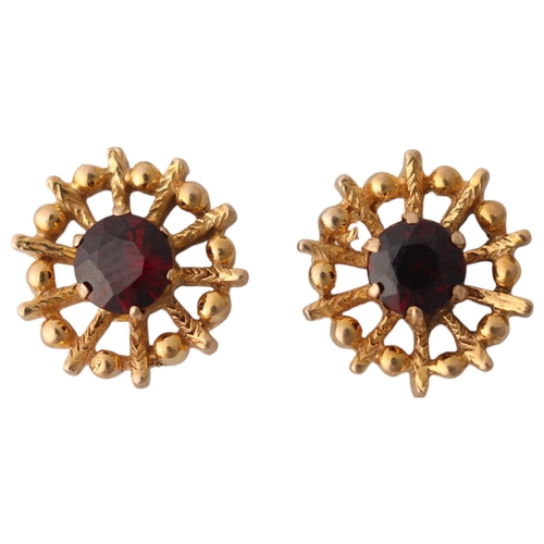 1357 - A pair of 9ct gold garnet stud earrings, naturalistic textured decoration, 11mm, 2.1g