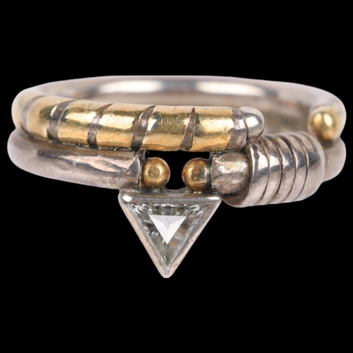 1448 - BARBARA BERTAGNOLLI - a silver and gold diamond band ring, rub-over set with triangular-cut diamond,... 