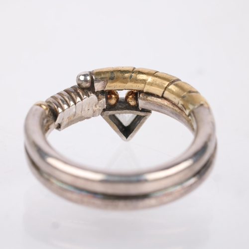 1448 - BARBARA BERTAGNOLLI - a silver and gold diamond band ring, rub-over set with triangular-cut diamond,... 